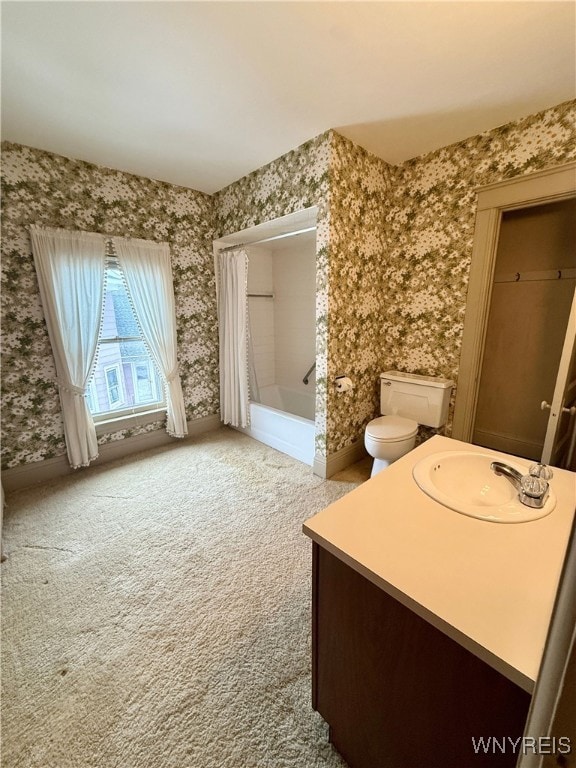 bathroom with walk in shower, vanity, and toilet