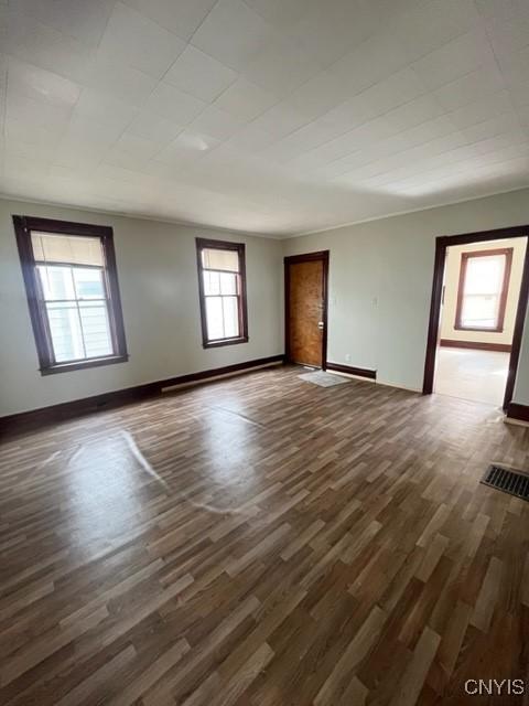 1218 City St, Utica, NY 13502 - empty room with baseboards and dark wood-style floors