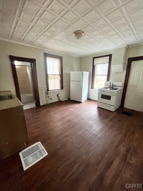 1218 City St, Utica, NY 13502 - interior space featuring visible vents, an ornate ceiling, crown molding, and dark wood-style flooring