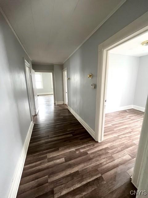 1218 City St, Utica, NY 13502 - hallway with wood finished floors, baseboards, and ornamental molding