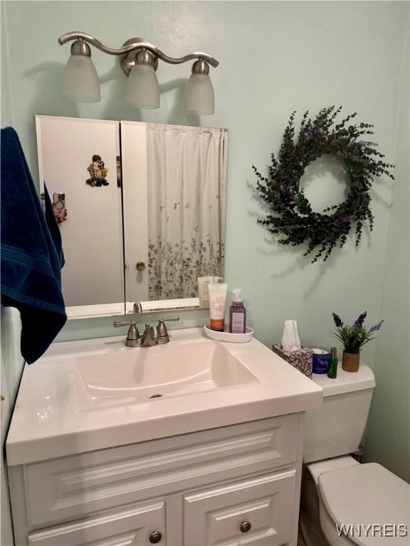 bathroom with vanity and toilet