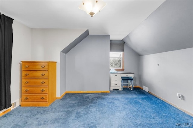 bonus room featuring vaulted ceiling and carpet