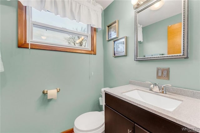 bathroom with vanity and toilet