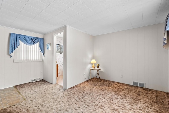 empty room featuring carpet floors