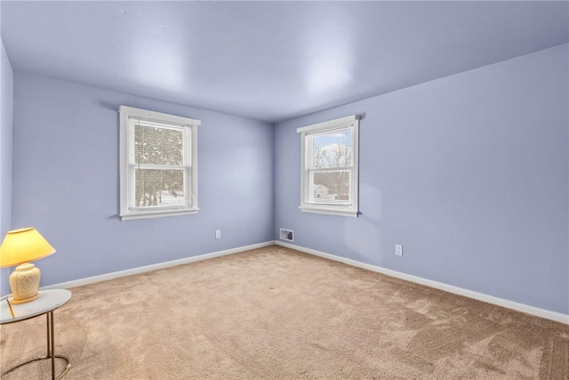 unfurnished room with carpet floors