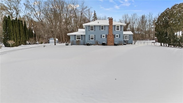 view of snow covered house