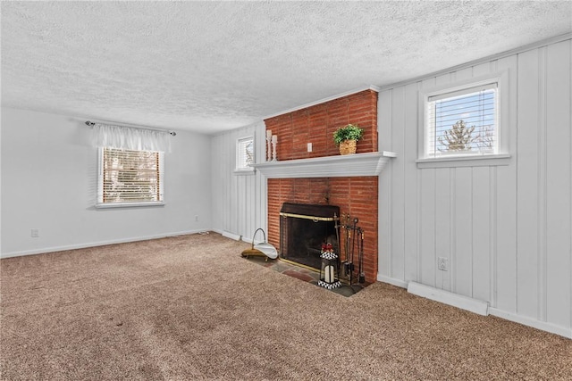 unfurnished living room featuring a brick fireplace, a wealth of natural light, and carpet floors