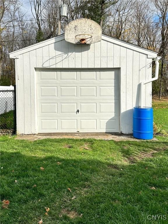 garage featuring a lawn