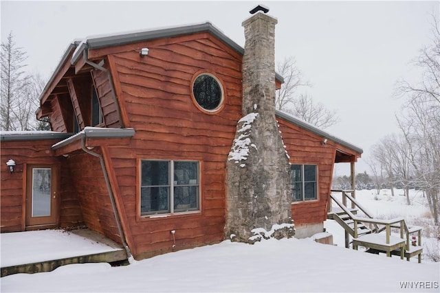 view of snow covered house