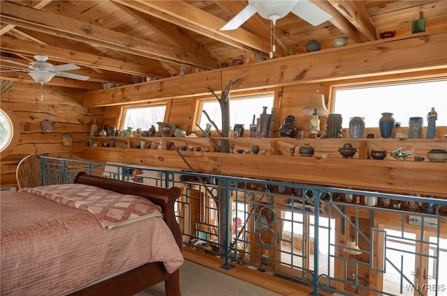 bedroom featuring lofted ceiling with beams, wooden ceiling, and wood walls