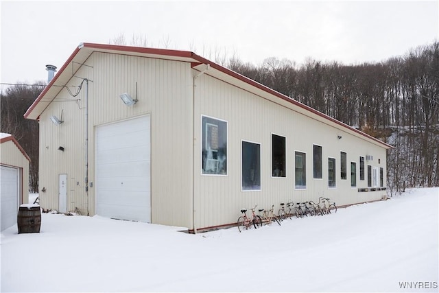 view of snow covered garage