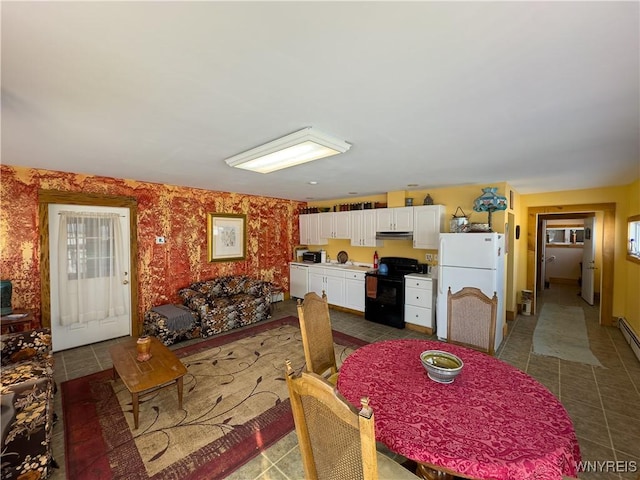 dining room with dark tile patterned floors