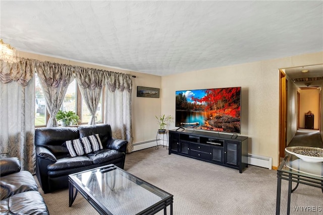 living room with a textured ceiling, carpet, and a baseboard heating unit