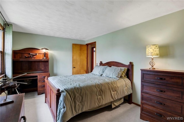 bedroom with light colored carpet