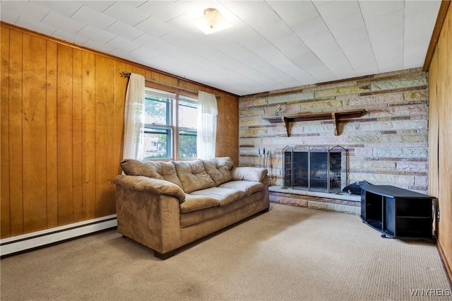 living room featuring a baseboard radiator, carpet flooring, wooden walls, and a fireplace