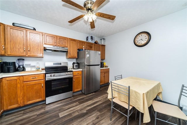 kitchen featuring stainless steel appliances, ceiling fan, and dark hardwood / wood-style flooring