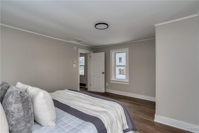 bedroom with crown molding and dark hardwood / wood-style flooring