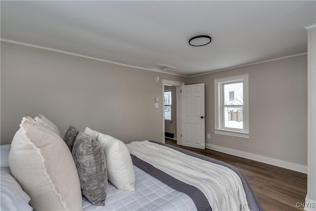 bedroom featuring wood-type flooring and ornamental molding