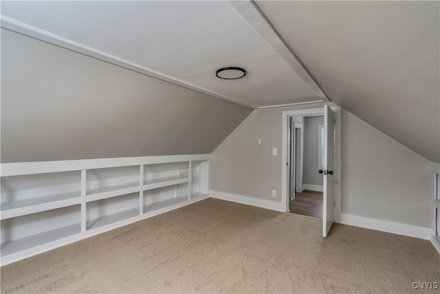 bonus room featuring carpet and lofted ceiling