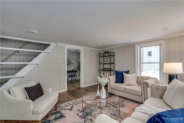 living room with crown molding and hardwood / wood-style floors