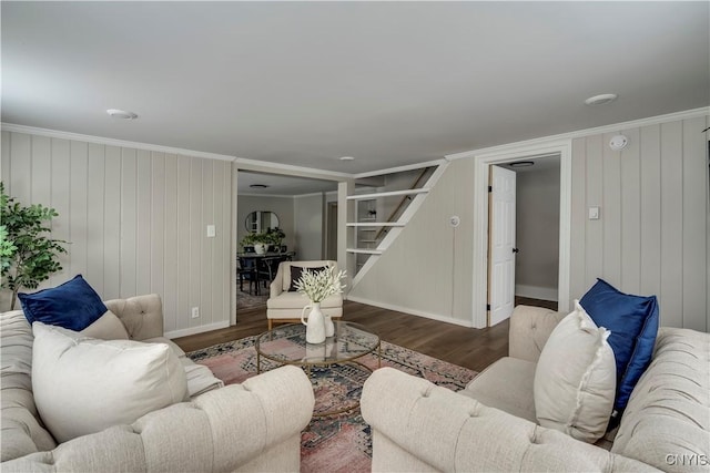 living room with ornamental molding and dark hardwood / wood-style floors