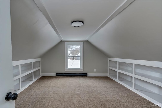 bonus room with vaulted ceiling, light carpet, built in features, and baseboard heating