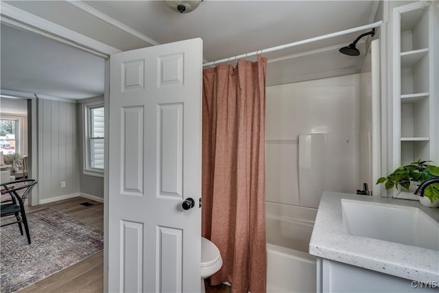 full bathroom with vanity, hardwood / wood-style flooring, toilet, and shower / bath combo with shower curtain