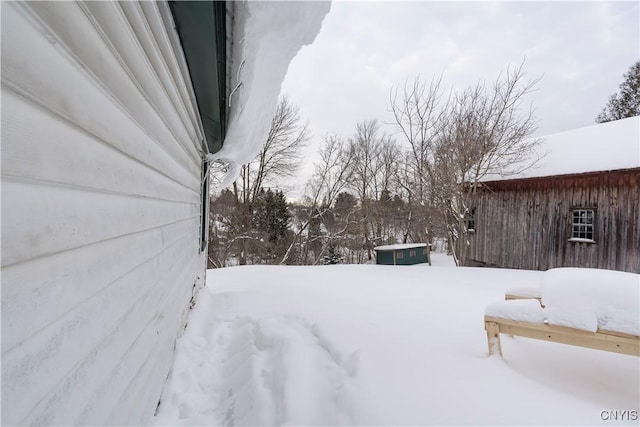 view of yard layered in snow