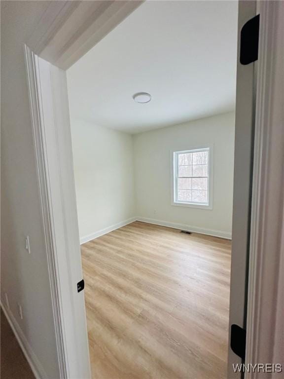 unfurnished room featuring light hardwood / wood-style floors