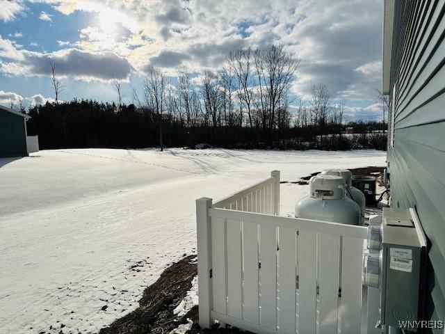 view of yard layered in snow