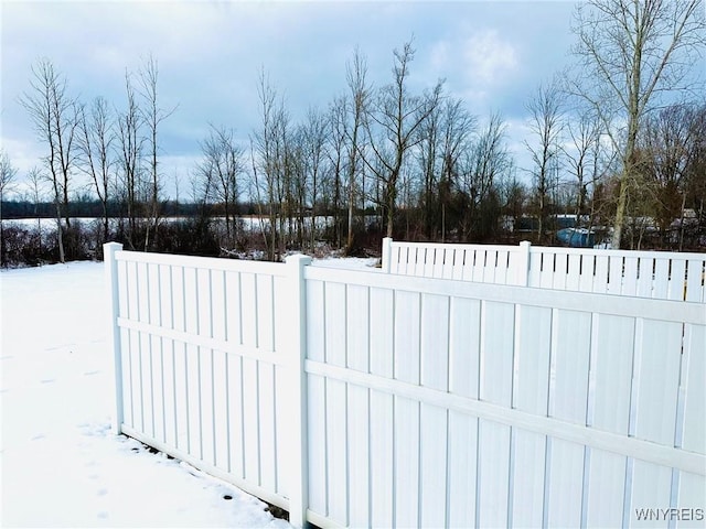 view of snow covered gate