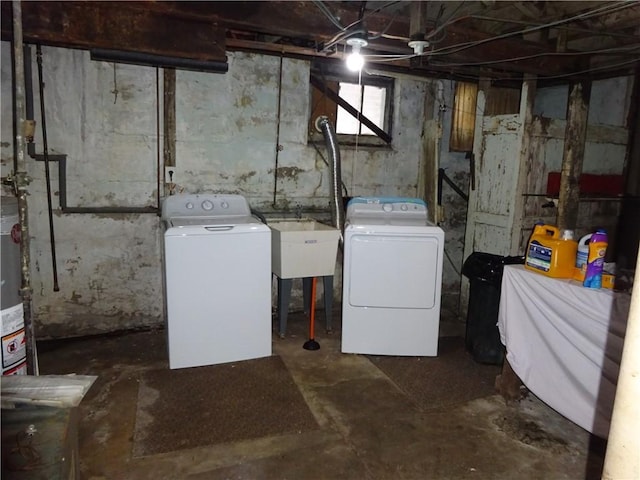 clothes washing area with washing machine and clothes dryer