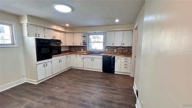 kitchen featuring white cabinetry, backsplash, sink, and black appliances