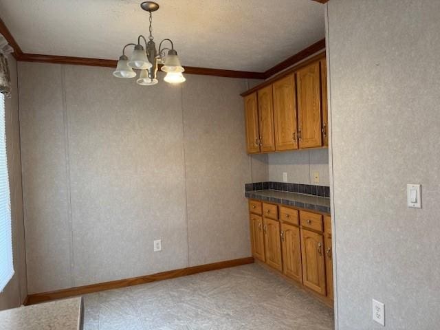 unfurnished living room featuring crown molding, light colored carpet, ceiling fan, and a textured ceiling