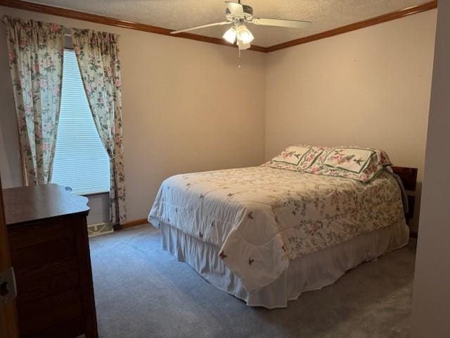 carpeted bedroom with crown molding, ceiling fan, and a textured ceiling