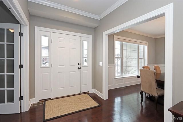 entrance foyer featuring crown molding and dark hardwood / wood-style floors