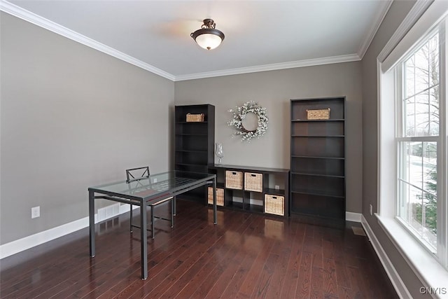 home office with ornamental molding and dark hardwood / wood-style floors