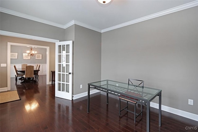 dining space featuring crown molding, dark hardwood / wood-style floors, an inviting chandelier, and french doors