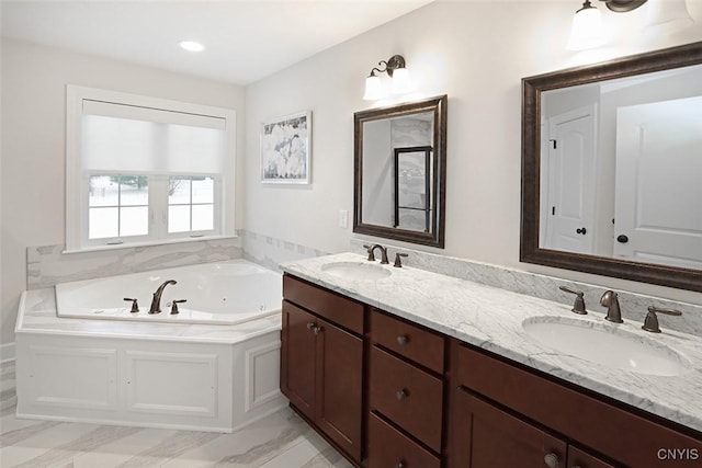 bathroom featuring vanity and a bathtub