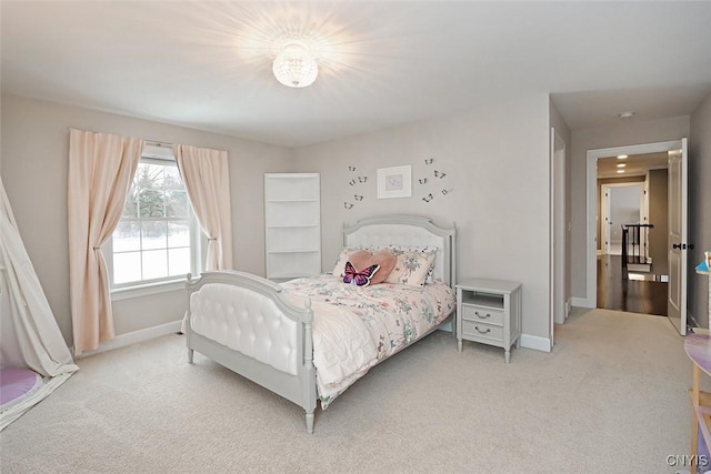 bedroom featuring light colored carpet