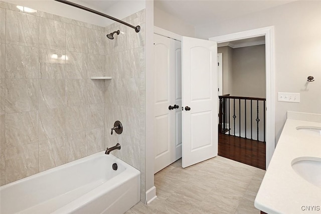 bathroom with vanity and tiled shower / bath combo