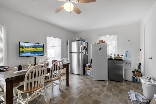 dining room featuring plenty of natural light and ceiling fan