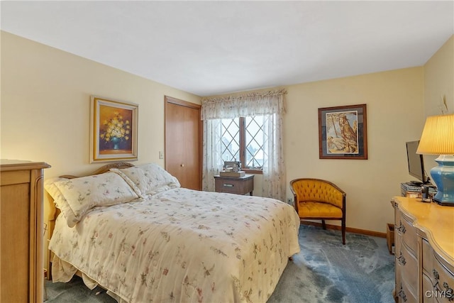 carpeted bedroom with a closet