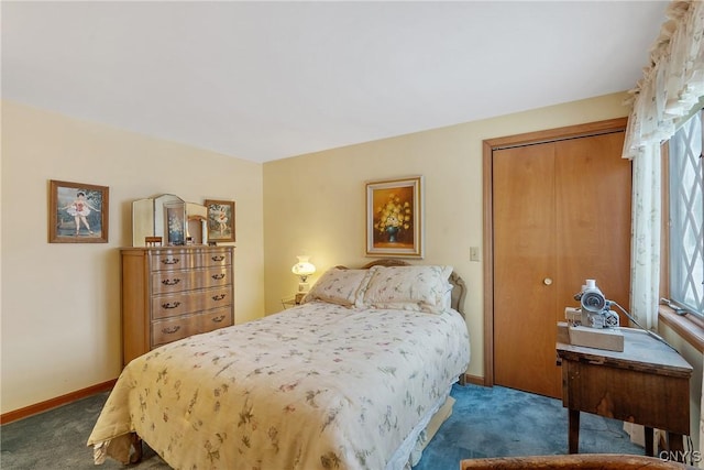 bedroom with dark colored carpet