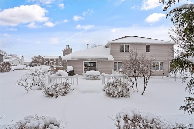 view of snow covered property