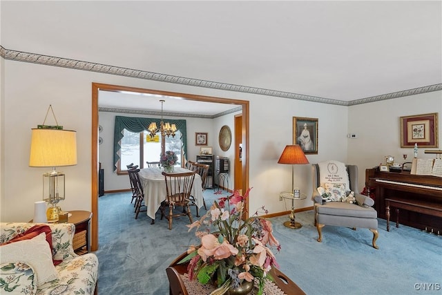 living room with ornamental molding, carpet, and a chandelier