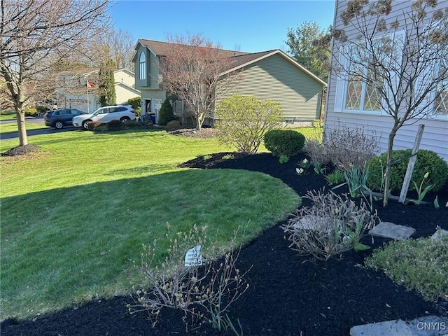 view of side of home featuring a yard