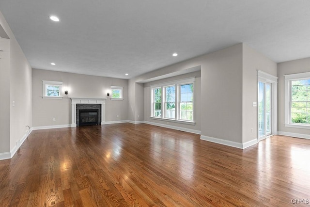 unfurnished living room with hardwood / wood-style floors