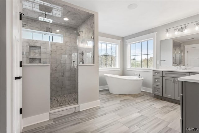 bathroom with vanity and plus walk in shower