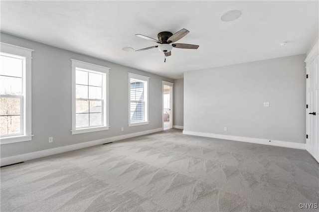 carpeted empty room with ceiling fan